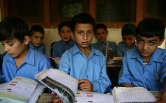 Students from a school supported by Hashoo Foundation in Chitral look on as they attend class.