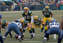 Aaron Rodgers (12), Korey Hall (35) and Ahman Green (34)