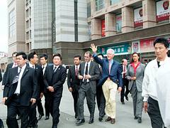 President Clinton walking in Urumqi