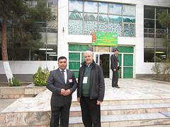 OSCE PA delegation head James Walsh (left) stands in front of a polling station with the chairman of the precinct election commission in Abadan District, outside Ashgabat, on 15 December.