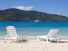 White Lounge Chair On Tropical Beach