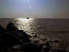 Distant ship, smoke in the horizon . . . . .